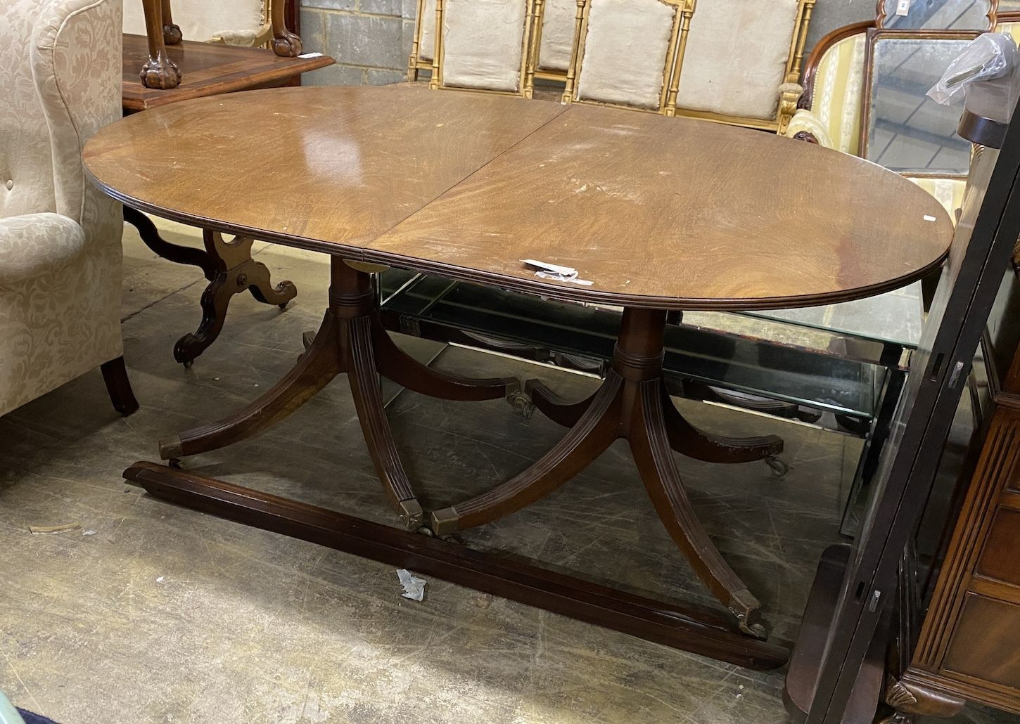 A George III style mahogany twin pedestal D end extending dining table, length 158cm, 248cm extended, two spare leaves, width 110cm, height 72cm